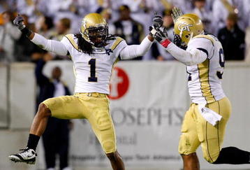 ATLANTA - OCTOBER 17:  Morgan Burnett #1 and Derrick Morgan #91 of the Georgia Tech Yellow Jackets  react after a defensive stop against the Virginia Tech Hokies at Bobby Dodd Stadium on October 17, 2009 in Atlanta, Georgia.  (Photo by Kevin C. Cox/Getty Images)