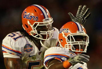 MIAMI - JANUARY 08:  Jermaine Cunningham #21 of the Florida Gators celebrates his interception with teammate Brandon Spikes #51 against the Oklahoma Sooners in the FedEx BCS National Championship Game at Dolphin Stadium on January 8, 2009 in Miami, Florida.  (Photo by Donald Miralle/Getty Images)