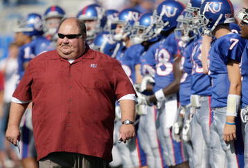 LAWRENCE, KS - SEPTEMBER 19:  Head coach Mark Mangino of the Kansas Jayhawks walk on the field before the game against the Duke Blue Devils on Kivisto Field at Memorial Stadium on September 19, 2009 in Lawrence, Kansas. (Photo by Jamie Squire/Getty Images)