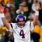 GREEN BAY, WI - NOVEMBER 01: Quarterback Brett Favre #4 of the Minnesota Vikings signals touchdown after teammate Adrian Petersen #20 scored during the first quarter of the game against the Green Bay Packers at Lambeau Field on November 1, 2009 in Green Bay, Wisconsin. (Photo by Scott Boehm/Getty Images)
