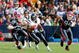 ORCHARD PARK, NY - NOVEMBER 01:  Ryan Moats #21 of the Houston Texans runs ahead of Paul Posluszny #51 and Aaron Schobel #94 of  the Buffalo Bills at Ralph Wilson Stadium on November 1, 2009 in Orchard Park, New York. Houston won 31-10.  (Photo by Rick Stewart/Getty Images)