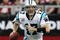 GLENDALE, AZ - NOVEMBER 01:  Quarterback Jake Delhomme #17 of the Carolina Panthers scrambles with the ball during the NFL game against the Arizona Cardinals at the Universtity of Phoenix Stadium on November 1, 2009 in Glendale, Arizona. The Panthers defeated the Cardinals 34-21.  (Photo by Christian Petersen/Getty Images)