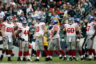 PHILADELPHIA - NOVEMBER 01: Eli Manning #10 of the New York Giants and his teammates look on after losing against the Philadelphia Eagles in the second half on November 1, 2009 at Lincoln Financial Field in Philadelphia, Pennsylvania. The Eagles defeated the Giants 40-17.  (Photo by Jim McIsaac/Getty Images)