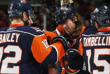 UNIONDALE, NY - NOVEMBER 02: Josh Bailey #12 (L)  and Steve Tambellini #15 (R) of the New York Islanders congratulate Brendan Witt #32 (C) on his second of two goals in the second period against the Edmonton Oilers at the Nassau Coliseum on November 2, 2009 in Uniondale, New York. (Photo by Bruce Bennett/Getty Images)