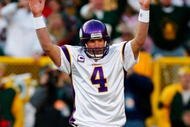 GREEN BAY, WI - NOVEMBER 01: Quarterback Brett Favre #4 of the Minnesota Vikings signals touchdown after teammate Adrian Petersen #20 scored during the first quarter of the game against the Green Bay Packers at Lambeau Field on November 1, 2009 in Green Bay, Wisconsin. (Photo by Scott Boehm/Getty Images)