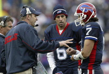 ORCHARD PARK, NY - NOVEMBER 27: Mike Mullarkey, head coach of the Buffalo Bills talks to JP Losman #7 as Shane Matthews #6 listens during a timeout against the Carolina Panthers  on November 27, 2005 at Ralph Wilson Stadium in Orchard Park, New York. (Photo by Rick Stewart/Getty Images)