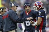 ORCHARD PARK, NY - NOVEMBER 27: Mike Mullarkey, head coach of the Buffalo Bills talks to JP Losman #7 as Shane Matthews #6 listens during a timeout against the Carolina Panthers  on November 27, 2005 at Ralph Wilson Stadium in Orchard Park, New York. (Photo by Rick Stewart/Getty Images)