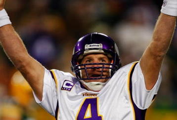 GREEN BAY, WI - NOVEMBER 01: Quarterback Brett Favre #4 of the Minnesota Vikings celebrates a touchdown by teammate Percy Harvin #12 after a 51 yard touchdown pass during the third quarter of the game against the Green Bay Packers at Lambeau Field on November 1, 2009 in Green Bay, Wisconsin. (Photo by Scott Boehm/Getty Images)