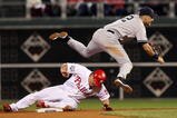 PHILADELPHIA - NOVEMBER 02:  Derek Jeter #2 of the New York Yankees turns a successful double play over Carlos Ruiz #51 in the bottom of the eighth inning against the Philadelphia Phillies in Game Five of the 2009 MLB World Series at Citizens Bank Park on November 2, 2009 in Philadelphia, Pennsylvania.  (Photo by Nick Laham/Getty Images)
