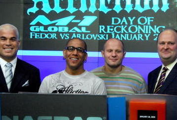 NEW YORK - JANUARY 20:  MMA fighter and former UFC light heavyweight champion Tito Ortiz, VP, Affliction Entertainment Tom Atencio and Fedor Vladimirovich Emelianenko, heavyweight mixed martial artist and current World Alliance of Mixed Martial Arts heavyweight champion rings the NASDAQ opening bell at NASDAQ in Times Square on January 20, 2009 in New York City.  (Photo by Joe Corrigan/Getty Images)