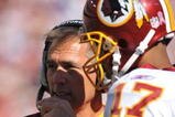 LANDOVER, MD - OCTOBER 4:  Head coach Jim Zorn speaks with Jason Campbell #17 of the Washington Redskins during a time out against the Tampa Bay Buccaneers at FedExField on October 4, 2009 in Landover, Maryland. The Redskins defeated the Buccaneers 16-13. (Photo by Larry French/Getty Images)