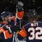 UNIONDALE, NY - NOVEMBER 02: Frans Nielsen #51 (L) of the New York Islanders congratulates Brendan Witt #32 (R) on his first of two goals in the second period against the Edmonton Oilers at the Nassau Coliseum on November 2, 2009 in Uniondale, New York. (Photo by Bruce Bennett/Getty Images)