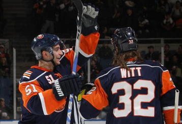 UNIONDALE, NY - NOVEMBER 02: Frans Nielsen #51 (L)  of the New York Islanders congratulates Brendan Witt #32 (R) on his first of two goals in the second period against the Edmonton Oilers at the Nassau Coliseum on November 2, 2009 in Uniondale, New York. (Photo by Bruce Bennett/Getty Images)