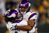GREEN BAY, WI - NOVEMBER 01: Quarterback Brett Favre #4 of the Minnesota Vikings celebrates with teammate Percy Harvin #12 after a 51 yard touchdown pass during the third quarter of the game against the Green Bay Packers at Lambeau Field on November 1, 2009 in Green Bay, Wisconsin. (Photo by Scott Boehm/Getty Images)