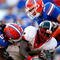 JACKSONVILLE, FL - OCTOBER 31:  Brandon Spikes #51 and Duke Lemmens #44 of the Florida Gators tackle Washaun Ealey #24 of the Georgia Bulldogs at Jacksonville Municipal Stadium on October 31, 2009 in Jacksonville, Florida.  (Photo by Kevin C. Cox/Getty Images)