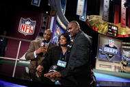 NEW YORK - APRIL 28:  (R-L) JaMarcus Russell and his mother Zina are interviewed by NFL legend and commentator Deon Sanders, after Russell was chosen first overall by the Oakland Raiders at the 2007 NFL Draft at Radio City Music Hall April 28, 2007 in New York City.  (Photo by Nick Laham/Getty Images)