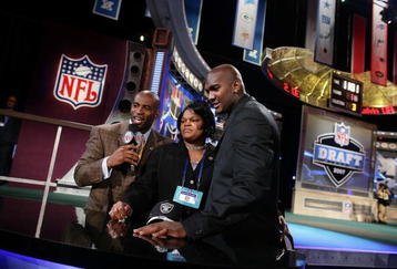 NEW YORK - APRIL 28:  (R-L) JaMarcus Russell and his mother Zina are interviewed by NFL legend and commentator Deon Sanders, after Russell was chosen first overall by the Oakland Raiders at the 2007 NFL Draft at Radio City Music Hall April 28, 2007 in New York City.  (Photo by Nick Laham/Getty Images)