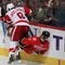 CALGARY, CANADA - OCTOBER 31: Justin Abdelkader #8 of the Detroit Red Wings checks Mark Giordano #5 the Calgary Flames on October 31st, 2009 at the Pengrowth Saddledome in Calgary, Alberta, Canada. (Photo by Dale MacMillan/Getty Images)