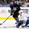 LOS ANGELES, CA - OCTOBER 29:  Scott Parse #63 of the Los Angeles Kings passes the puck past Kevin Bieksa #3 of the Vancouver Canucks in the second period at Staples Center on October 29, 2009 in Los Angeles, California.  (Photo by Jeff Gross/Getty Images)