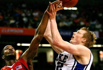 ATLANTA - MARCH 14:  Dino Gregory #33 defends as Landon Milbourne #1 of the Maryland Terrapins blocks a shot by Kyle Singler #12 of the Duke Blue Devils during the semifinals of the 2009 ACC Men's Basketball Tournament on March 14, 2009 at the Georgia Dome in Atlanta, Georgia.  (Photo by Kevin C. Cox/Getty Images)