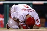 PHILADELPHIA - NOVEMBER 02:  Shane Victorino #8 of the Philadelphia Phillies reacts after he was hit on the hand and the butt of the bat on a swing in the bottom of the second inning against the New York Yankees in Game Five of the 2009 MLB World Series at Citizens Bank Park on November 2, 2009 in Philadelphia, Pennsylvania.  (Photo by Nick Laham/Getty Images)