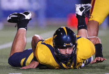 BERKELEY, CA - OCTOBER 03:  Kevin Riley #13 of the California Golden Bears lies on the ground against the USC Trojans at Memorial Stadium on October 3, 2009 in Berkeley, California.  (Photo by Jed Jacobsohn/Getty Images)