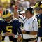 ANN ARBOR, MI - SEPTEMBER 19: Head coach Rich Rodriguez of the Michigan Wolverines is flanked by quarterbacks Tate Forcier #5 and David Cone #17 as he signals during the game with the Eastern Michigan Eagles at Michigan Stadium on September 19, 2009 in Ann Arbor, Michigan. Michigan won 45-17. (Photo by Stephen Dunn/Getty Images)
