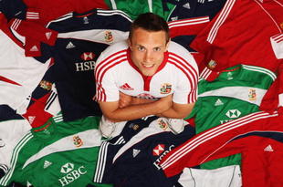 BAGSHOT, ENGLAND - MAY 18:  Mike Blair of Scotland stands among some of the 7,500 pieces of adidas kit that the British & Irish Lions will take to South Africa during the kitting out day for the British & Irish Lions 2009 Tour to South Africa at Pennyhill Park on May 18, 2009 in Bagshot, England. Each member of the best equipped Lions team ever will have at least 80 pieces of personalised adidas training-wear and match-wear in his kitbag.  (Photo by Bryn Lennon/Getty Images for adidas)