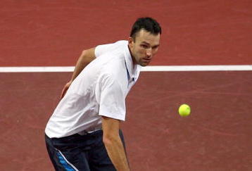 BASEL, SWITZERLAND - NOVEMBER 02:  Ivo Karlovic of Croatia plays a volley in his match against Florent Serra of France during Day One of the Davidoff Swiss Indoors Tennis at St Jakobshalle on November 2, 2009 in Basel, Switzerland.  (Photo by Julian Finney/Getty Images)