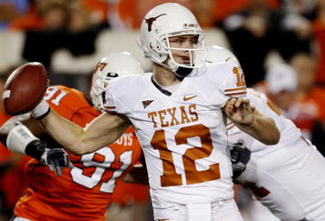 STILLWATER, OK - OCTOBER 31:  Quarterback Colt McCoy #12 of the Texas Longhorns goes back for a pass in the first quarter against the Oklahoma State Cowboys at Boone Pickens Stadium on October 31, 2009 in Stillwater, Oklahoma.  (Photo by Ronald Martinez/Getty Images)