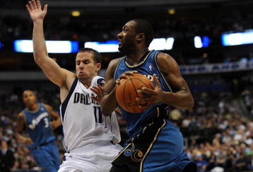 DALLAS - OCTOBER 27:  Guard Gilbert Arenas #0 of the Washington Wizards is fouled by Jose Juan Barea #11 of the Dallas Mavericks during the season opener on October 27, 2009 at American Airlines Center in Dallas, Texas.  NOTE TO USER: User expressly acknowledges and agrees that, by downloading and/or using this Photograph, user is consenting to the terms and conditions of the Getty Images License Agreement.  (Photo by Ronald Martinez/Getty Images)