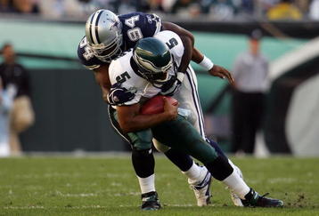 PHILADELPHIA - OCTOBER 08:  Donovan McNabb #5 of the Philadelphia Eagles is sacked by DeMarcus Ware #94 of the Dallas Cowboys in the first quarter at Lincoln Financial Field on October 8, 2006 in Philadelphia, Pennsylvania.  (Photo by Chris McGrath/Getty Images)