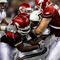 ARLINGTON, TX - OCTOBER 03:  Running back Christine Michael #33 of the Texas A&M Aggies is tackled by DeQuinta Jones #92 and Jake Bequette #91 of the Arkansas Razorbacks at Dallas Cowboys Stadium on October 3, 2009 in Arlington, Texas.  (Photo by Ronald Martinez/Getty Images)