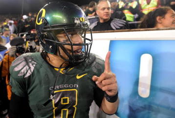 EUGENE, OR - OCTOBER 31: Quarterback Jeremiah Masoli #8 of the Oregon Ducks celebrates with fans on the sidelines as time runs down in the fourth quarter of the game against the USC Trojans at Autzen Stadium on October 31, 2009 in Eugene, Oregon. Masoli threw for 222 yards and a touchdown and ran for 164 more yards with another score as the Ducks upset the Trojans 47-20. (Photo by Steve Dykes/Getty Images)