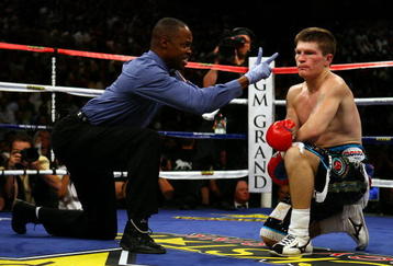 LAS VEGAS - MAY 02:  Ricky Hatton of England sits on the mat as referee Kenny Bayless counts down in the first round after Hatton was knocked down by Manny Pacquiao of the Philippines during their junior welterweight title fight at the MGM Grand Garden Arena May 2, 2009 in Las Vegas, Nevada.  (Photo by Al Bello/Getty Images)