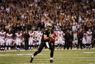 NEW ORLEANS - NOVEMBER 2: Quarterback Drew Brees #12 of the New Orleans Saints celebrates a complete pass against the Atlanta Falcons during the fourth quarter of the game at the Louisiana Superdome on November 2, 2009 in New Orleans, Louisiana. (Photo by Chris Graythen/Getty Images)