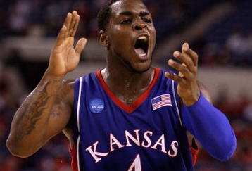 INDIANAPOLIS - MARCH 27:  Sherron Collins #4 of the Kansas Jayhawks reacts in the first half against the Michigan State Spartans during the third round of the NCAA Division I Men's Basketball Tournament at the Lucas Oil Stadium on March 27, 2009 in Indianapolis, Indiana.  (Photo by Andy Lyons/Getty Images)
