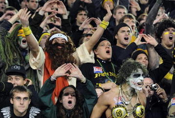 EUGENE, OR - OCTOBER 31:  Oregon Ducks fans make some noise on a Halloween night game against the USC Trojans at Autzen Stadium on October 31, 2009 in Eugene, Oregon. The crowd noise at Autzen Stadium is said to be one of the loudest in the nation and reportedly was a factor in Oregon defeating USC 47-20.  (Photo by Steve Dykes/Getty Images)