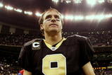 NEW ORLEANS - NOVEMBER 2:  Quarterback Drew Brees #9 of the New Orleans Saints leaves the field after leading his team to a 35-27 victory over the Atlanta Falcons in the game at the Louisiana Superdome on November 2, 2009 in New Orleans, Louisiana. (Photo by Chris Graythen/Getty Images)
