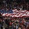 CARSON, CA - JANUARY 19: Fans of the U.S. Men's National Team unfurl a flag of the USA in the stands during the international friendly against Sweden on January 19, 2008 at the Home Depot Center in Carson, California. USA defeated Sweden 2-0. (Photo by Stephen Dunn/Getty Images)