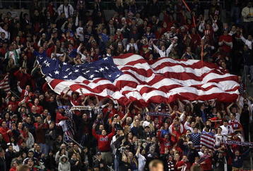 CARSON, CA - JANUARY 19:  Fans of the U.S. Men's National Team unfurl a flag of the USA in the stands during the international friendly against Sweden on January 19, 2008 at the Home Depot Center in Carson, California. USA defeated Sweden 2-0. (Photo by Stephen Dunn/Getty Images)