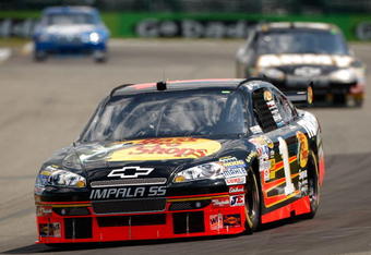 WATKINS GLEN, NY - AUGUST 07:  Martin Truex Jr. drives the #1 Bass Pro Shops Chevrolet during practice for the NASCAR Sprint Cup Series Heluva Good! Sour Cream Dips at Watkins Glen International on August 7, 2009 in Watkins Glen, New York.  (Photo by Chris Graythen/Getty Images)