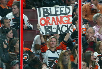 PHILADELPHIA - OCTOBER 22:  A fan of the Philadelphia Flyers cheers on her team as they play the Boston Bruins on October 22, 2009 at Wachovia Center in Philadelphia, Pennsylvania. The Flyers won the game 4-3 after a shootout.  (Photo by Jim McIsaac/Getty Images)