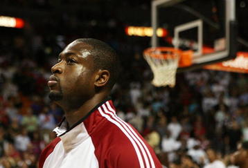 MIAMI - OCTOBER 28:  Dwyane Wade #3 of the Miami Heat stands for the National Anthem before taking on the New York Knicks at AmericanAirlines Arena on October 28, 2009 in Miami, Florida. The Heat defeated the Knicks 115-93. NOTE TO USER: User expressly acknowledges and agrees that, by downloading and/or using this Photograph, user is consenting to the terms and conditions of the Getty Images License Agreement.  (Photo by Doug Benc/Getty Images)