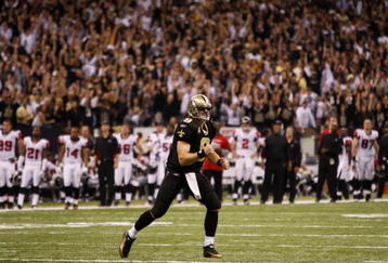 NEW ORLEANS - NOVEMBER 2: Quarterback Drew Brees #12 of the New Orleans Saints celebrates a complete pass against the Atlanta Falcons during the fourth quarter of the game at the Louisiana Superdome on November 2, 2009 in New Orleans, Louisiana. (Photo by Chris Graythen/Getty Images)
