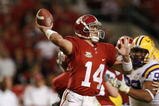 TUSCALOOSA, AL - NOVEMBER 03:  John Parker Wilson #14 of the Alabama Crimson Tide throws a touchdown pass against the LSU Tigers at Bryant-Denny Stadium on November 3, 2007 in Tuscaloosa, Alabama. LSU defeated Alabama 41-34.  (Photo by Doug Benc/Getty Images)