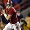 TUSCALOOSA, AL - NOVEMBER 29:  Quarterback Greg McElroy #12 of the Alabama Crimson Tide rolls out to pass against the Auburn Tigers at Bryant-Denny Stadium on November 29, 2008 in Tuscaloosa, Alabama. Alabama defeated Auburn 36-0.  (Photo by Doug Benc/Getty Images)