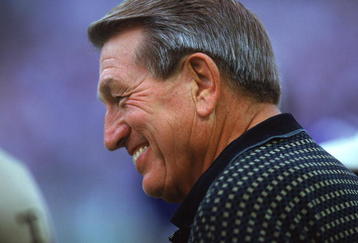BALTIMORE - SEPTEMBER 24:  A close up of Hall of Fame Quarterback Johnny Unitas, formerly of the Baltimore Colts, as he smiles and looks on during the game between the Cincinnati Bengals and the Baltimore Ravens on September 24, 2000 at PSINet Stadium in Baltimore, Maryland. The Ravens defeated the Bengals 37-0.  (Photo By David Leeds/Getty Images)