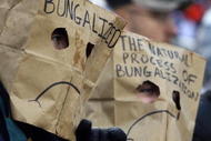 CINCINNATI - NOVEMBER 30:  Two football spectators wear bags over their heads during the NFL game between the Baltimore Ravens and the Cincinnati Bengals on November 30, 2008 at Paul Brown Stadium in Cincinnati, Ohio. The Ravens defeated the Bengals 34-3.(Photo by Andy Lyons/Getty Images)