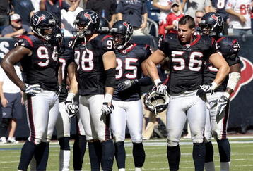 HOUSTON - OCTOBER 25:  Linebacker Brian Cushing #56 of the Houston Texans takes a break along with defensive end Connor Barwin #98 and Antonio Smith #94 during the game against the San Francisco 49ers at Reliant Stadium on October 25, 2009 in Houston, Texas.  (Photo by Bob Levey/Getty Images)